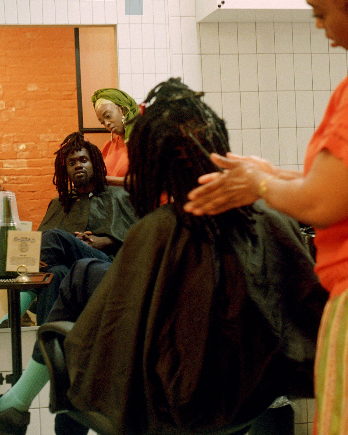 A man with dreadlocks at a barbershop