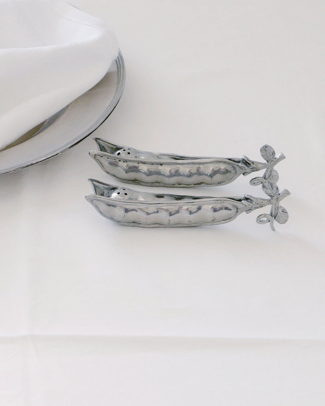 Silver decoration on a white cloth table